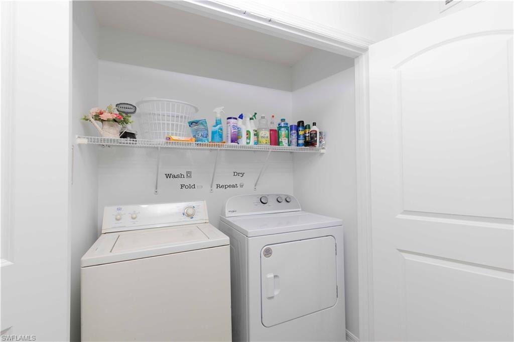 Dedicated laundry area with a top-load washer and front-load dryer