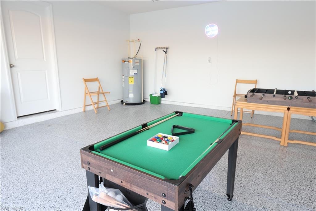 Epoxy-coated flooring, white interior walls, and a built-in water heater