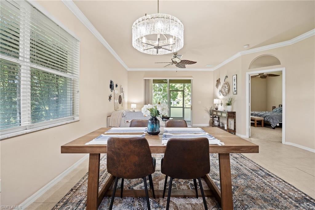 Recessed lighting, crown molding, and an arched doorway