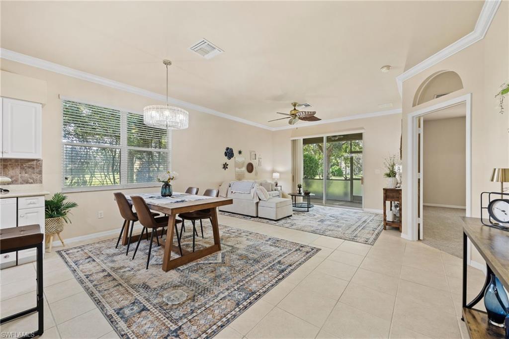 Open-concept living space featuring tile flooring, recessed ceiling lighting, and a ceiling fan
