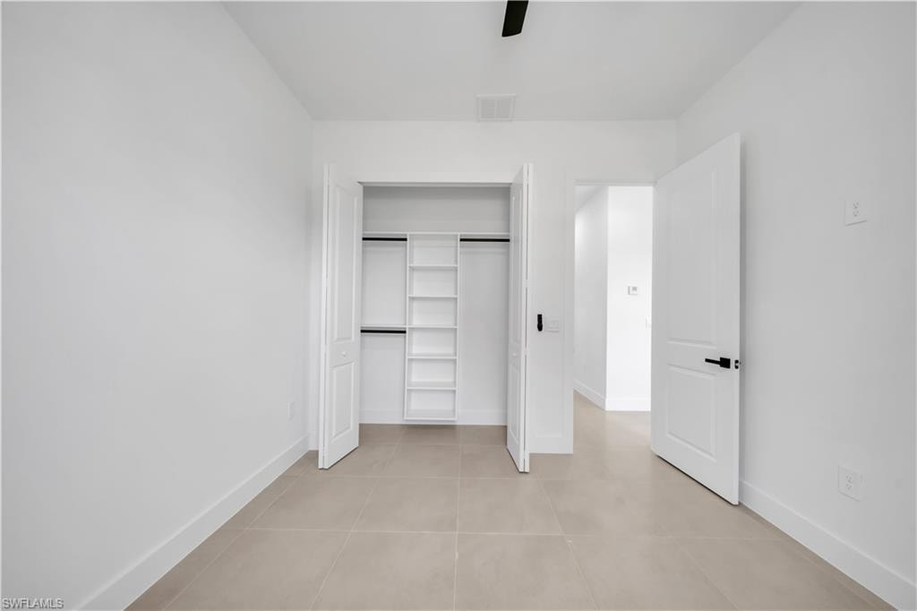 Recessed closet with integrated shelving and hanging rods