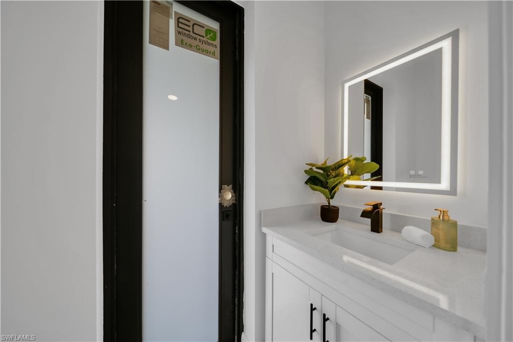Integrated vanity with a white countertop and undermount sink