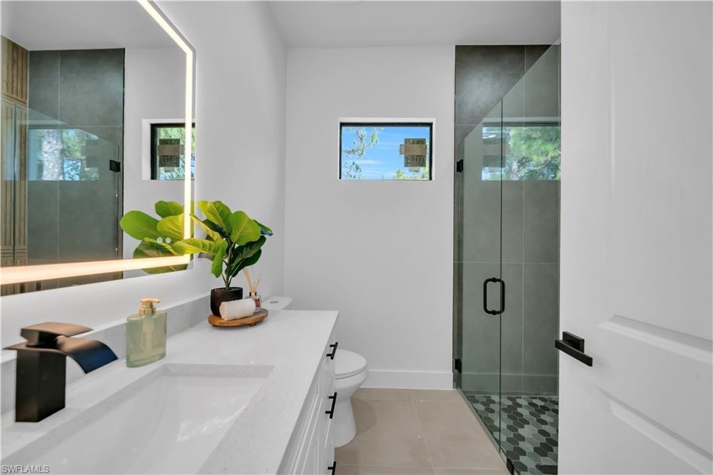 Modern vanity with an integrated rectangular sink, quartz countertop, and matte black faucet