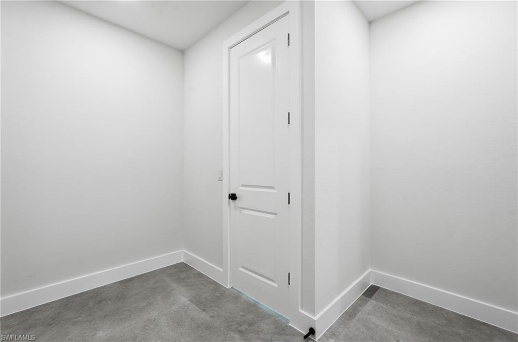 Walk in closet with access to laundry