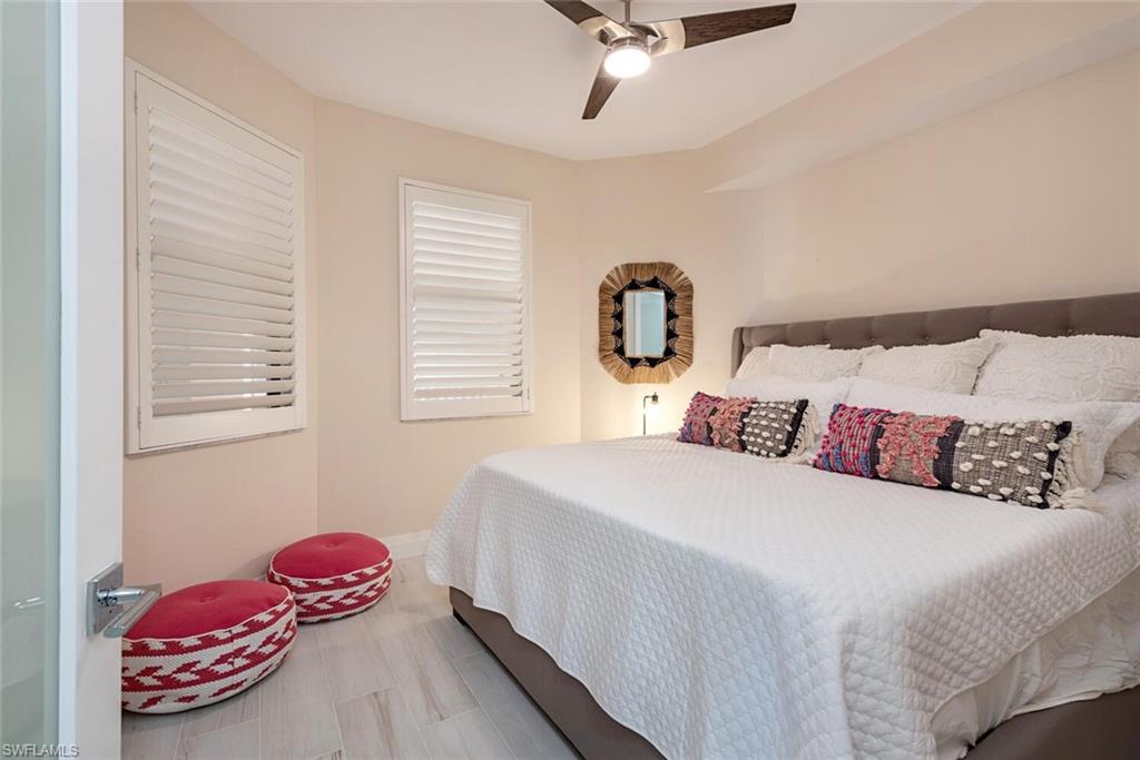 Bedroom with a ceiling fan and baseboards