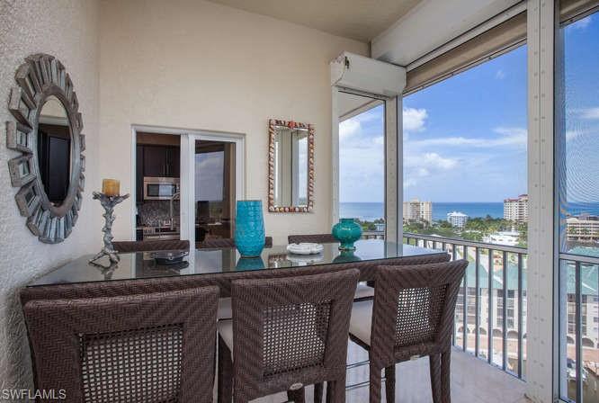 Sunroom with a water view