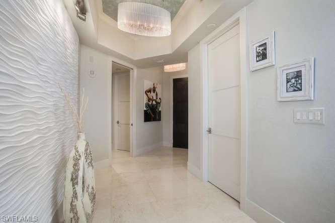 Hallway featuring baseboards