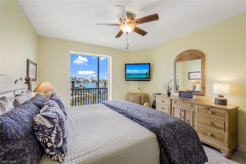 Bedroom with access to outside and a ceiling fan