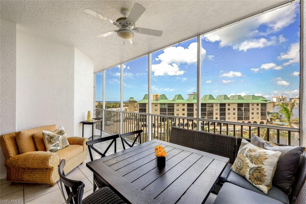 Sunroom featuring ceiling fan