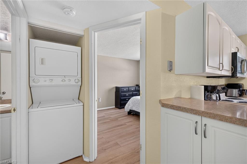 Integrated stackable laundry appliances