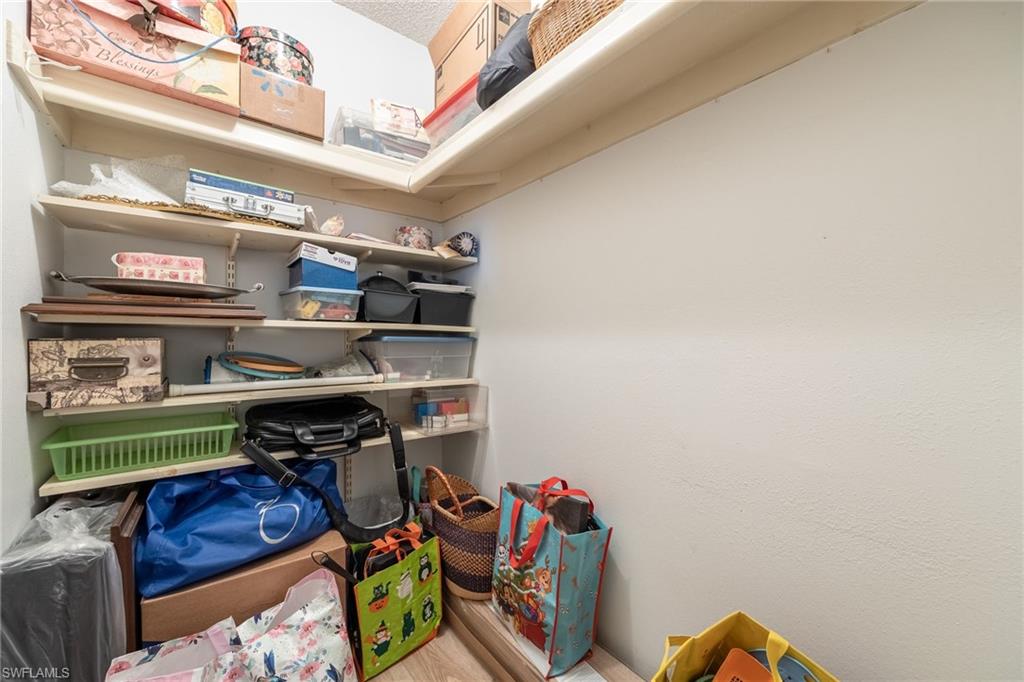 Built-in shelving with adjustable shelves in a neutral-toned space