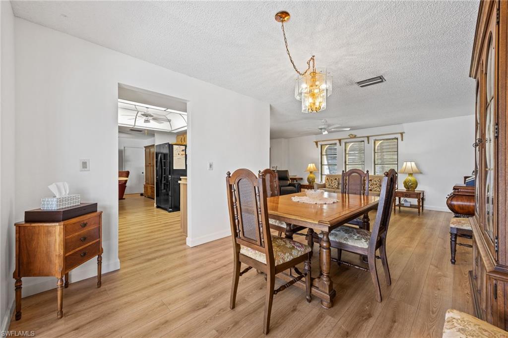 Wood-finish flooring throughout, with a recessed archway
