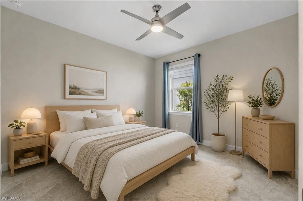 Spacious room featuring ceiling fan with integrated lighting, window with blue drapes, and light-toned flooring