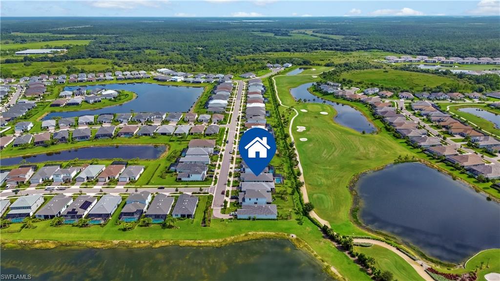 Community setting featuring a golf course, multiple water features, and developed residential areas
