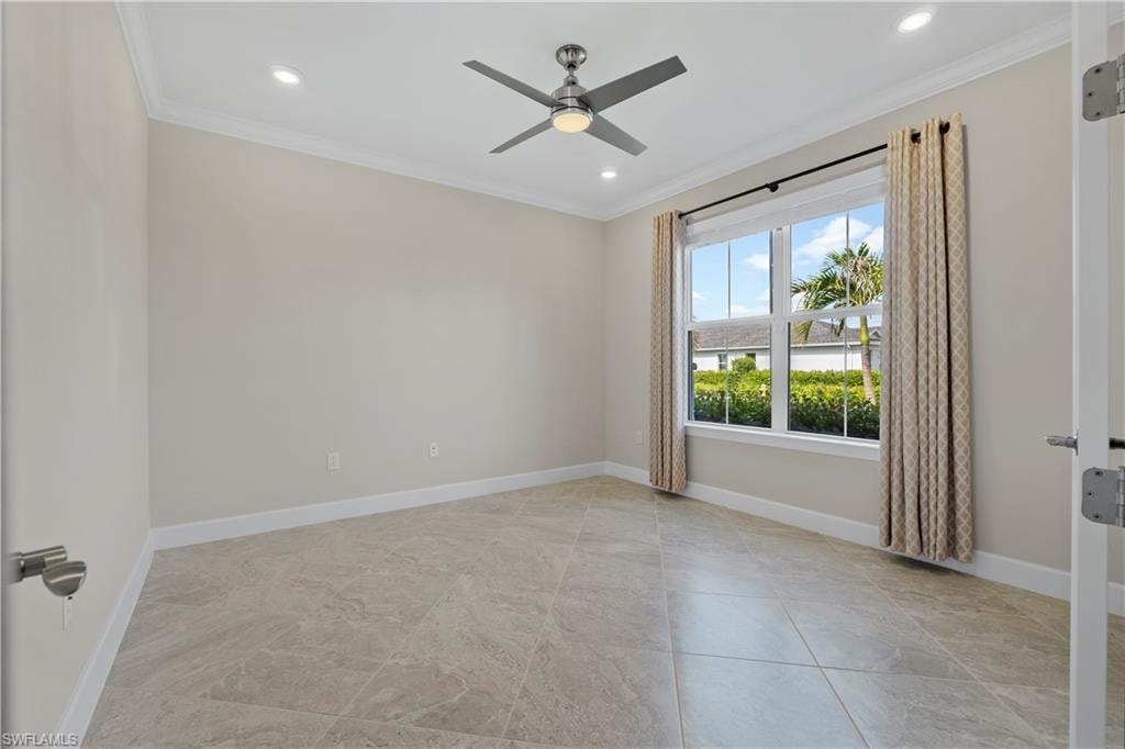 Recessed lighting, crown molding, modern ceiling fan, large window, and tile flooring