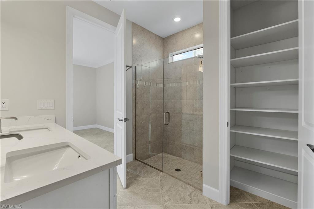 Dual vanity with undermount sinks and light-toned countertops