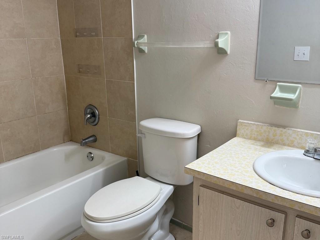 Tub-shower combination with tiled surround