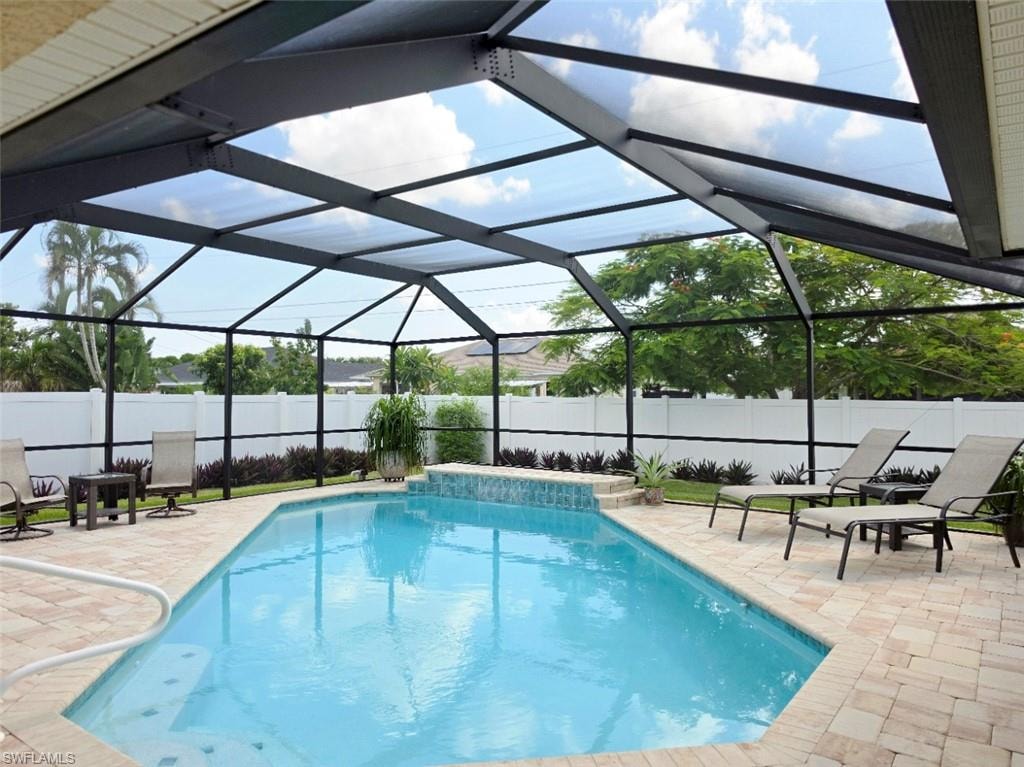Screened enclosure with an in-ground swimming pool
