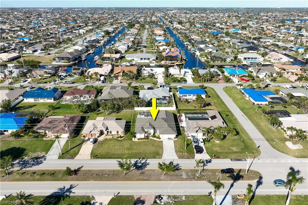 Birds eye view of property featuring a residential view and a water view