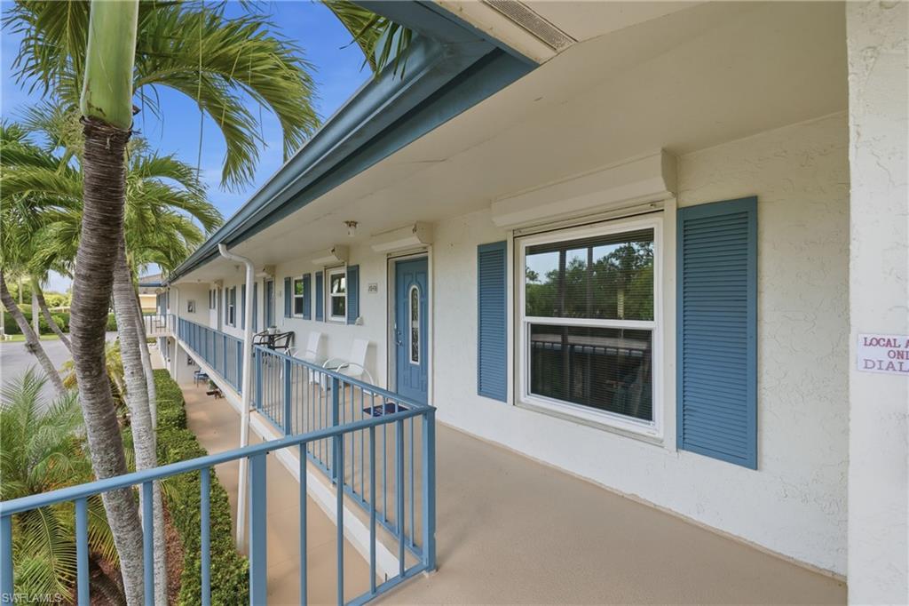 The covered second floor walkway leading to the private entry