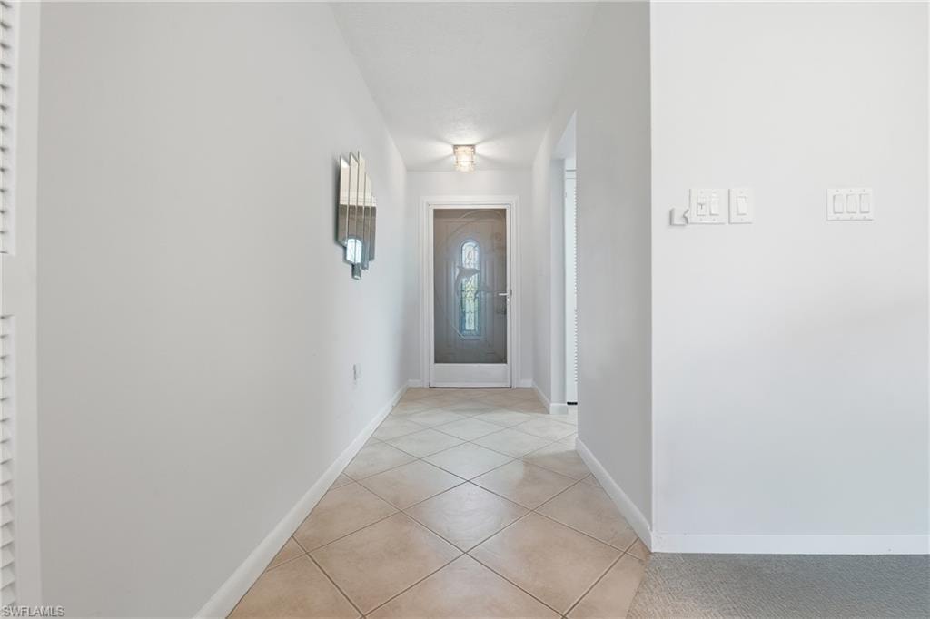 Tiled entry hall welcomes you at the leaded glass front door