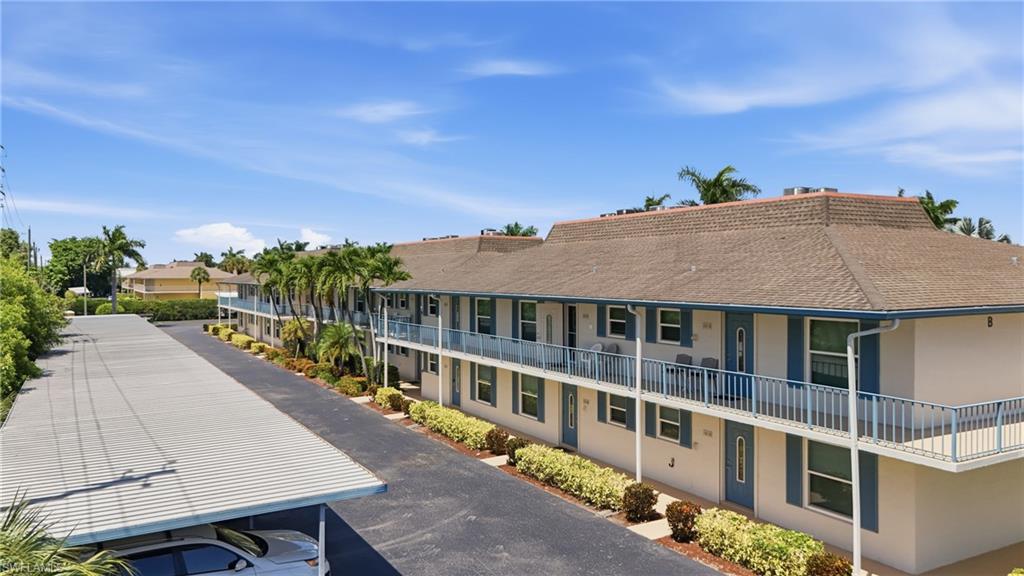 Assigned covered carport sits steps from Building B