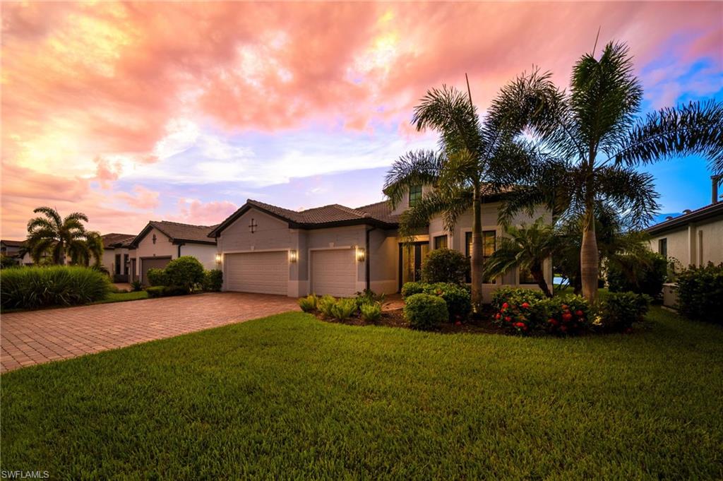 Stucco exterior with a tile roof  and an attached 3-car garage for plenty of storage