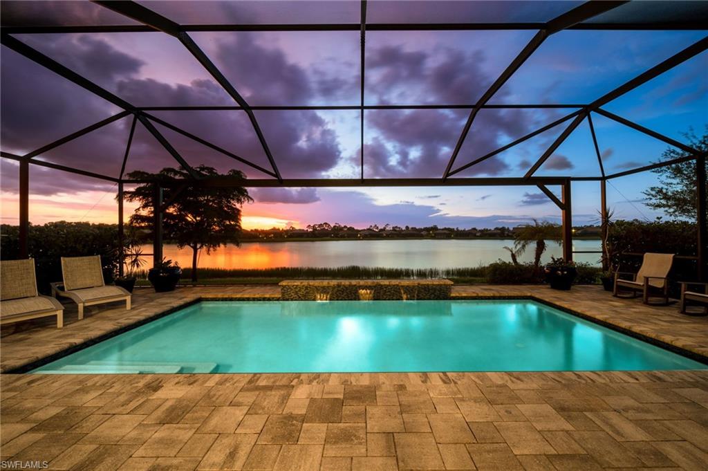 Screened enclosure featuring sunset views overlooking a lake