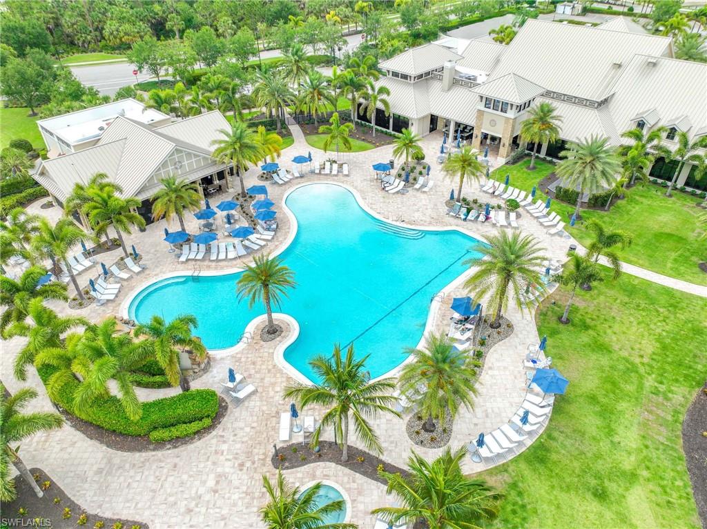 Expansive community pool with a free-form design, residents only on site restaurant and club house