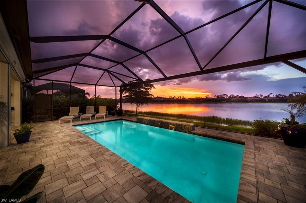 Screened-in swimming pool with rear water views