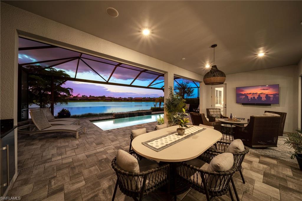 Beautiful sunset views over the  lake from your covered rear lanai to entertain or relax