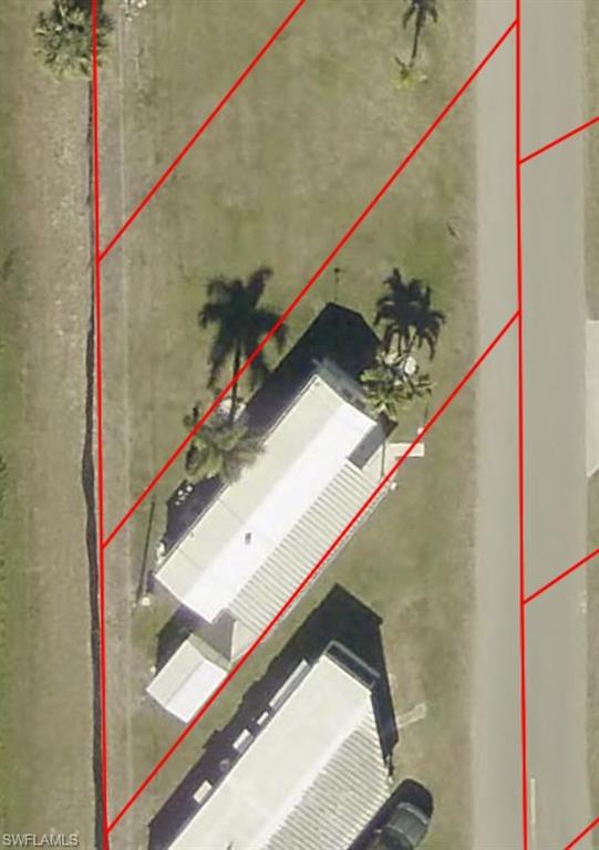 Aerial Map. Illustrating property boundaries and structures in relation to roadway