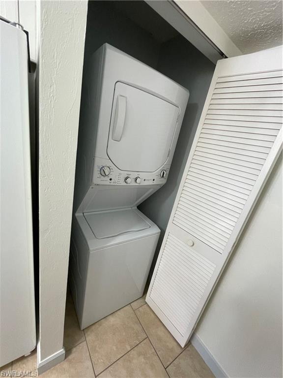 Stackable washer and dryer unit with louvered bi-fold doors
