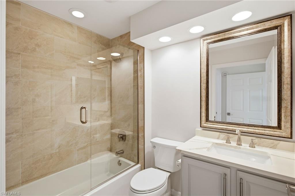 beautifully appointed guest bath with quartz countertops and a shower/tub combination provide comfort and versatility for family and guests.
