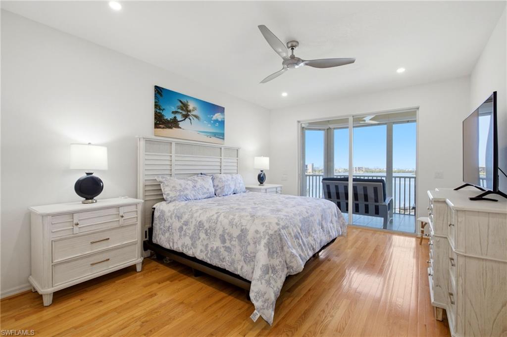The spacious primary suite offers direct access to the lanai and a generous walk-in closet.