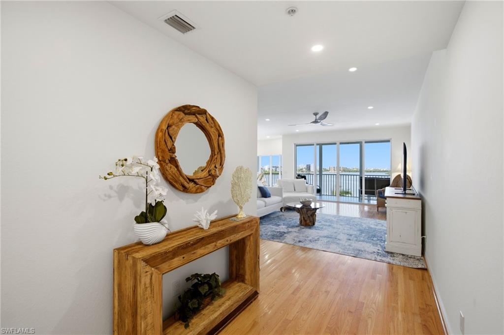As you pass through the elegant double-door entry, your gaze is immediately drawn to the breathtaking, uninterrupted vistas beyond.
