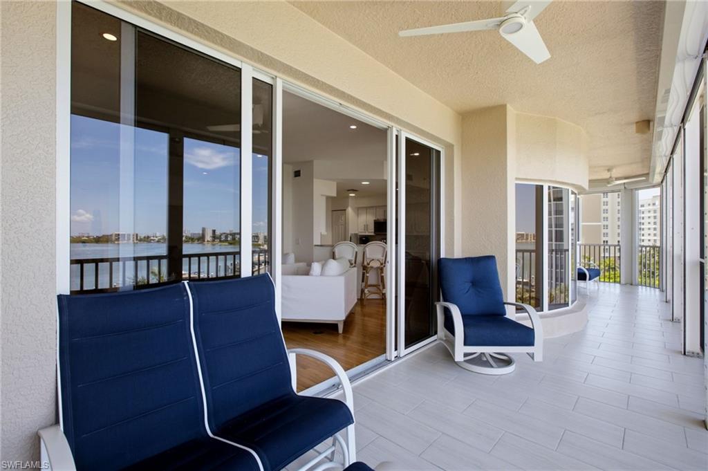 The expansive lanai features stylish subway tile flooring and comprehensive hurricane protection, offering a refined outdoor retreat designed for year-round enjoyment.