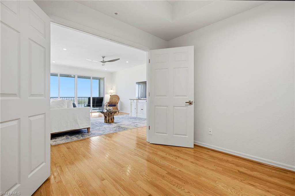 The versatile den/office can easily serve as a private third bedroom, featuring elegant double doors that provide comfort, privacy, and flexibility for guests or family.