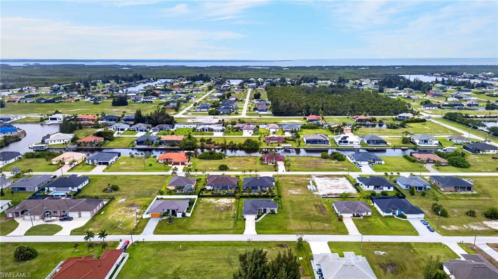 Residential community with multiple homesites, some featuring direct canal access