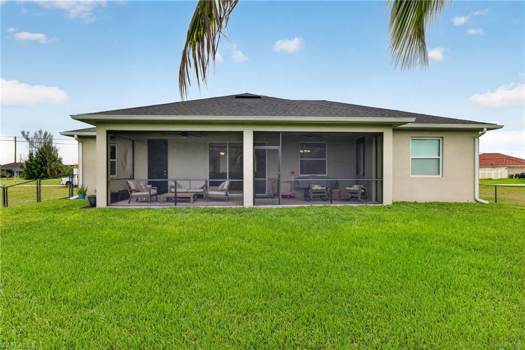 Screened patio with a covered roof, concrete flooring, and ample space for outdoor seating