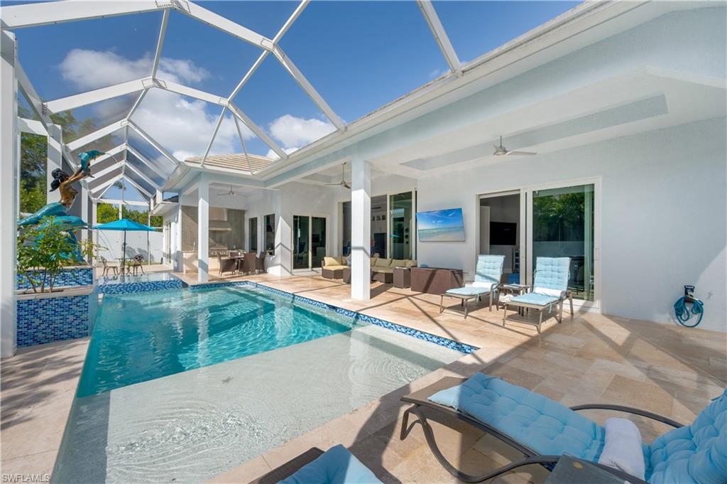 Outdoor pool with a patio area, a sunroom, an outdoor hangout area, outdoor dining area, and a lanai