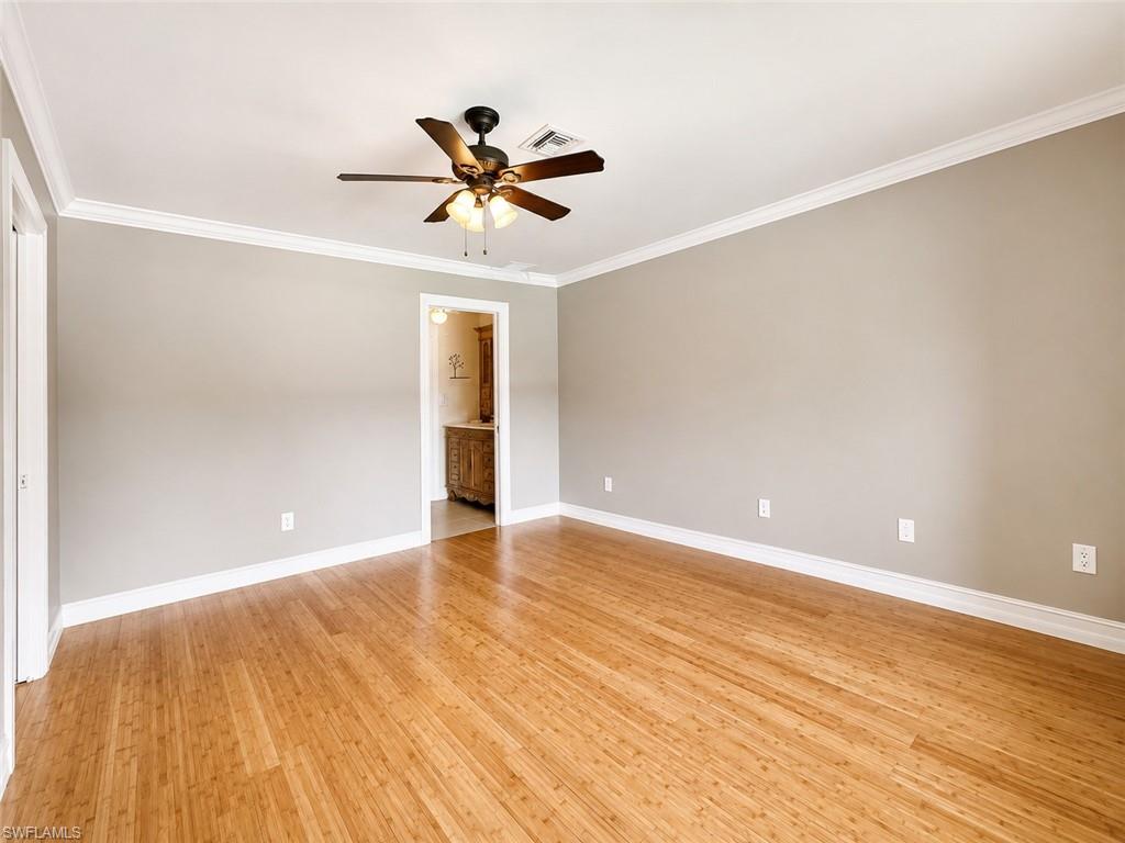 Ornate wood vanity with an integrated sink and light-toned countertop
