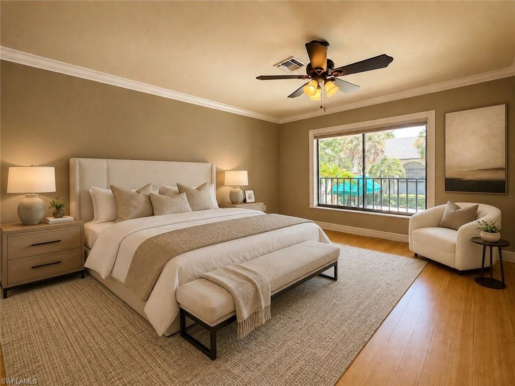Hardwood-style flooring, crown molding, ceiling fan, neutral wall tones, and white trim