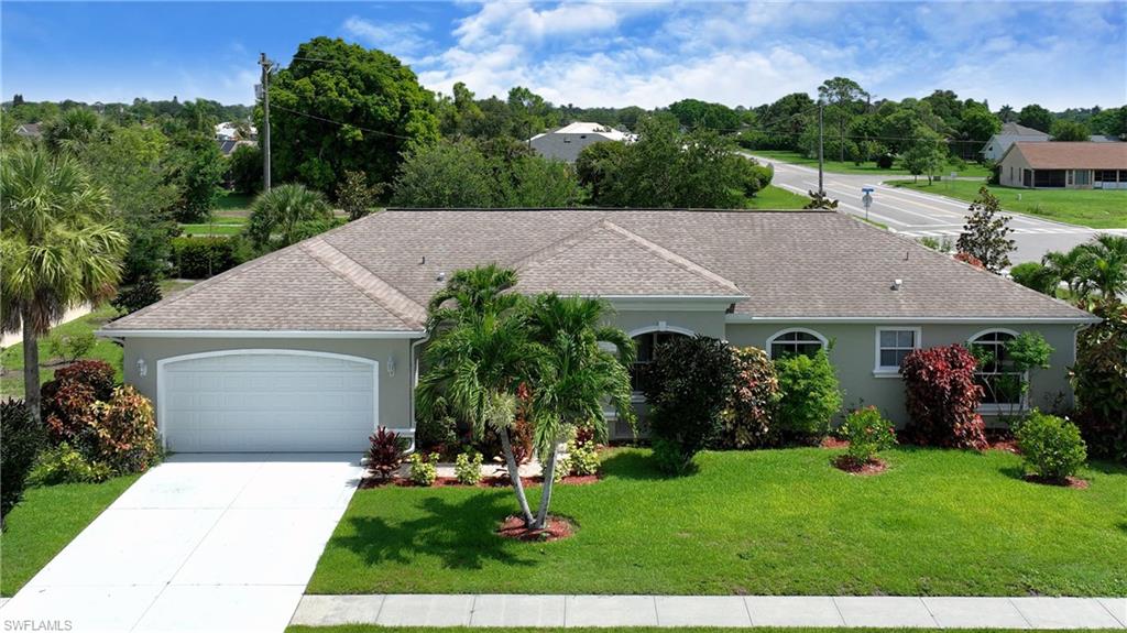 Single-story residence featuring a gray exterior, gray shingle roof, and an attached two-car garage