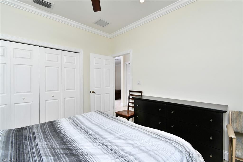 Recessed lighting, crown molding, ceiling fan, bi-fold closet doors, and light-toned walls
