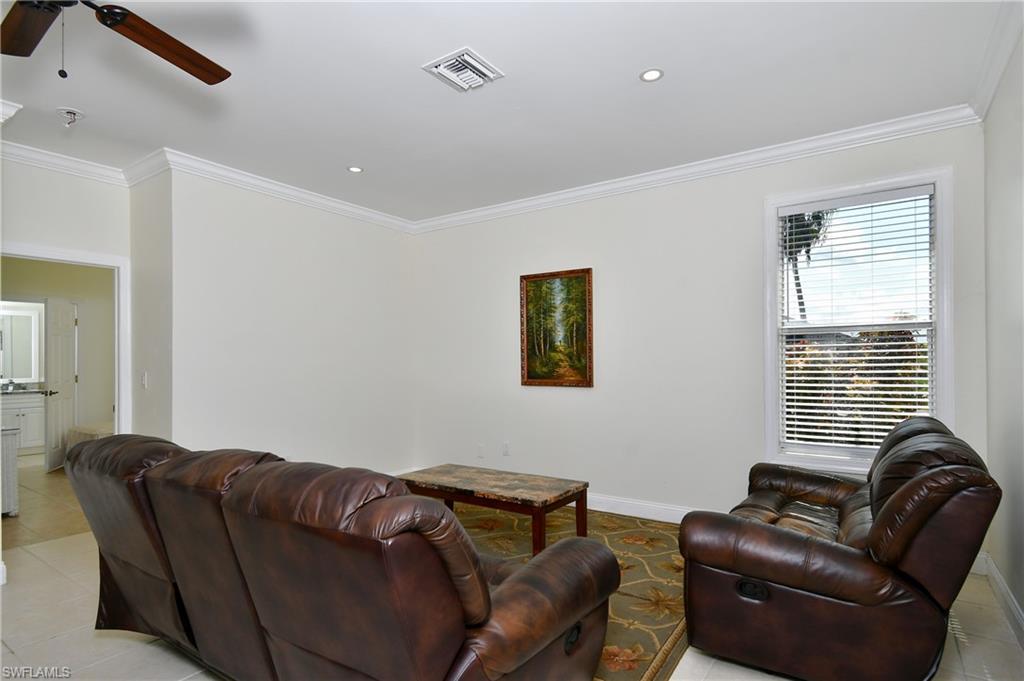 Crown molding, recessed lighting, ceiling fan, single window with blinds, and tile flooring
