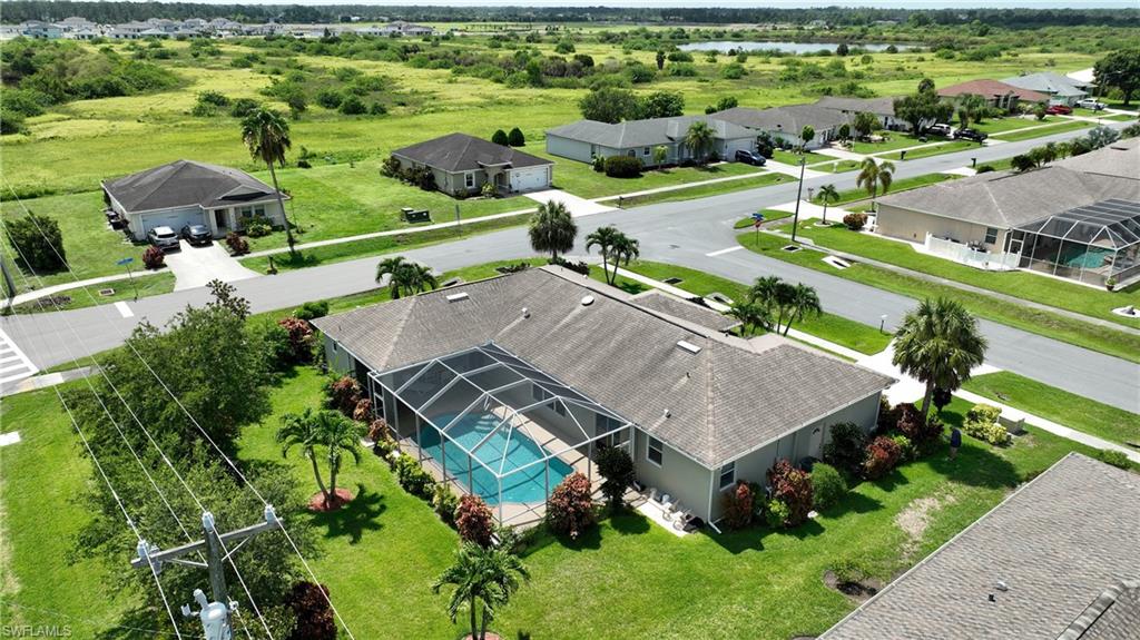 Screened-in swimming pool and paved patio