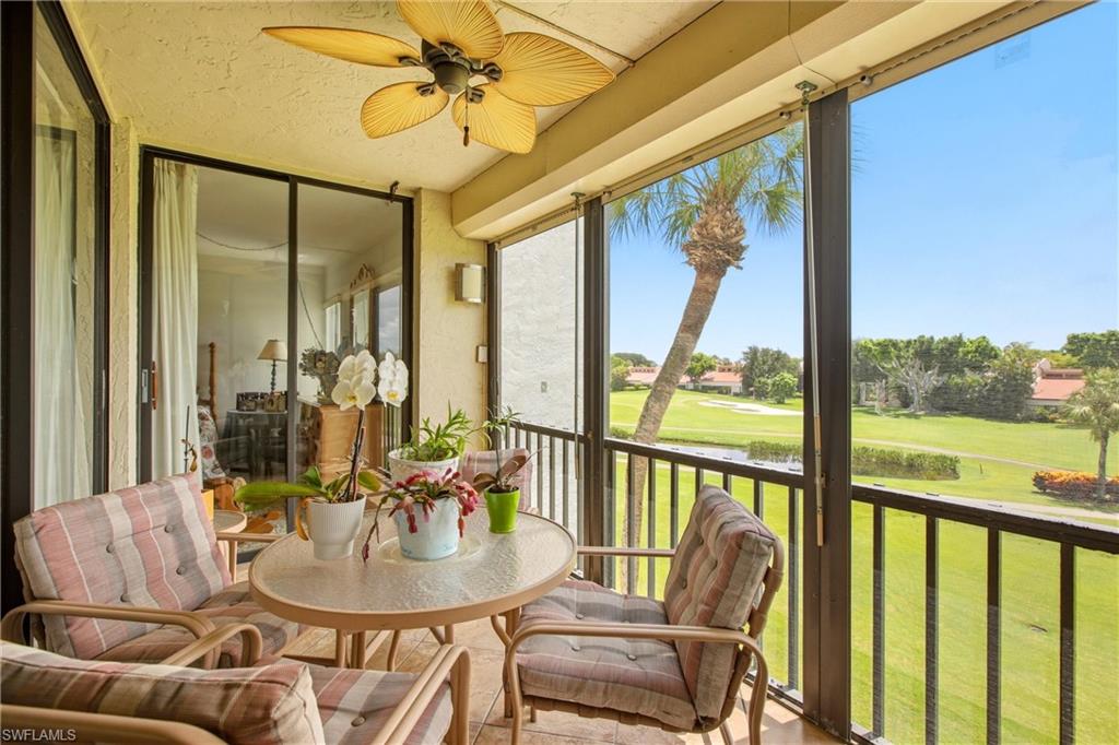 Screened balcony with ceiling fan and direct golf course frontage
