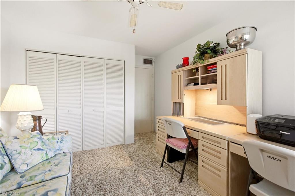 Built-in desk unit with integrated lighting and upper cabinetry