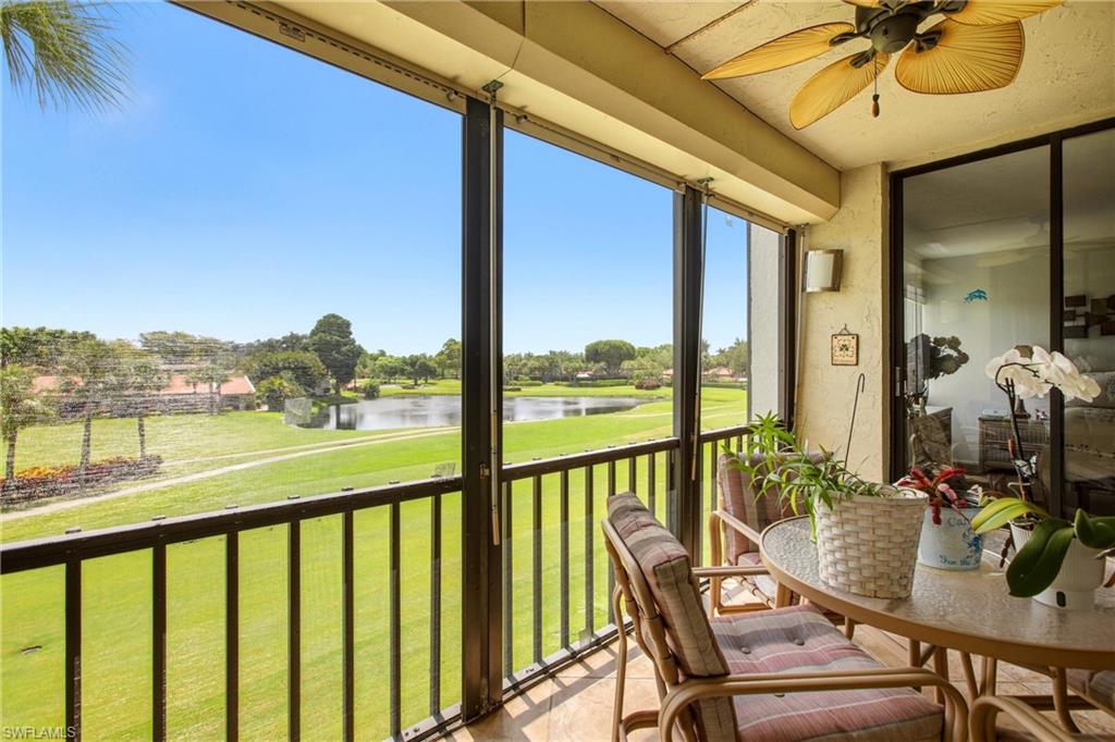 Screened balcony with expansive water and green space frontage